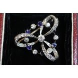 A fine white and yellow metal, diamond and sapphire set 'Easter Trinity' brooch, the central diamond