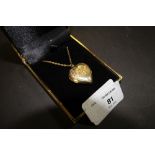 Heart shaped locket pendant marked 9ct front & back with 9ct gold chain 6grams gross weight