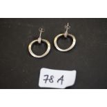 Pair white metal pendant disc earrings