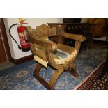 Carved X framed chair with armorial crest