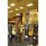 4 African hand carved wooden figurines