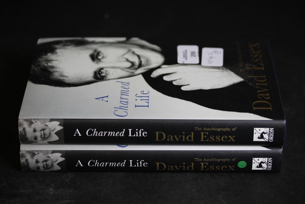 Essex [David], two copies of A Charmed Life, both signed first editions