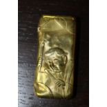 Victorian brass vesta case embossed with medieval style figures and in set with a compass