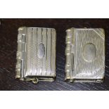 Two late Victorian chromed/plated metal book form vesta cases, one with integral sovereign case