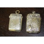 Edwardian Art Nouveau plated vesta case with scrolled body and one other plated vesta case