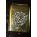 Early 20th century brass matchbook holder set to front with a clock face
