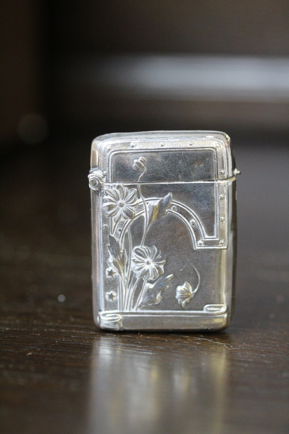 Early 20th Century Dutch 900 grade silver vesta case of Art Nouveau design, embossed with flowers,