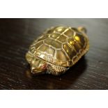 Victorian embossed brass tortoise vesta case with red enamelled eyes