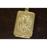 Early 20th century embossed brass match book holder bearing Hapsburg crest and one other vesta