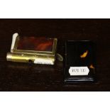 20th century simulated tortoise shell match book holder and a brass and leather vesta case with