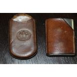 Brown leather pouch style vesta case embossed 'London' and a leather mounted plated vesta case