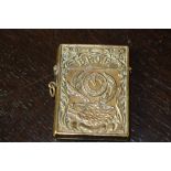 Victorian embossed brass vesta case of large size, decorated with clock face, stage and initials '