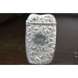 Late 19th Century American cast silver vesta case, with relief scrollwork marked 'Sterling 1927',