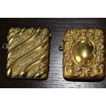 Two Victorian embossed brass vesta cases