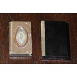Late Victorian pressed horn book pattern vesta case inset with plated plaque and a black plastic