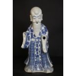 19th Century Chinese blue and white Immortal figure, decorated with a variety of motifs, lacking