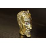 Victorian embossed brass 'Devil's head' vesta case set with glass eyes