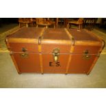 Wooden banded trunk and contents of mixed fabric etc