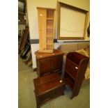 Pine revolving bookcase, mahogany magazine rack, mahogany corner chest and oak cupboard