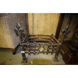 Wrought iron dog grate with Fleu dis lis terminals