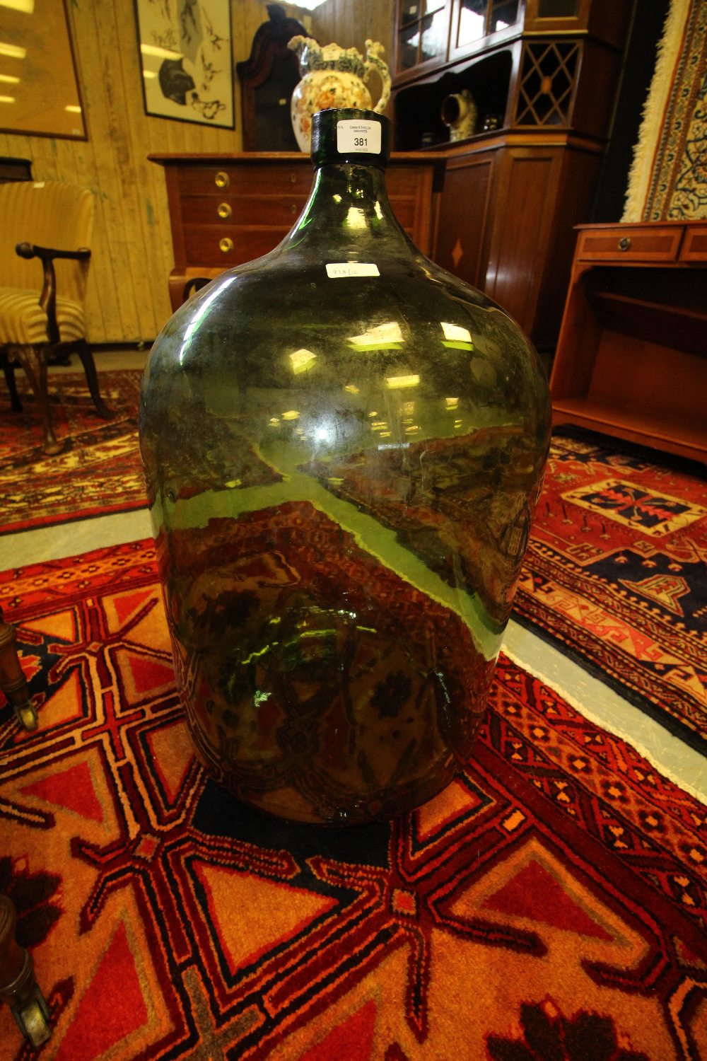 Large green glass carbouy