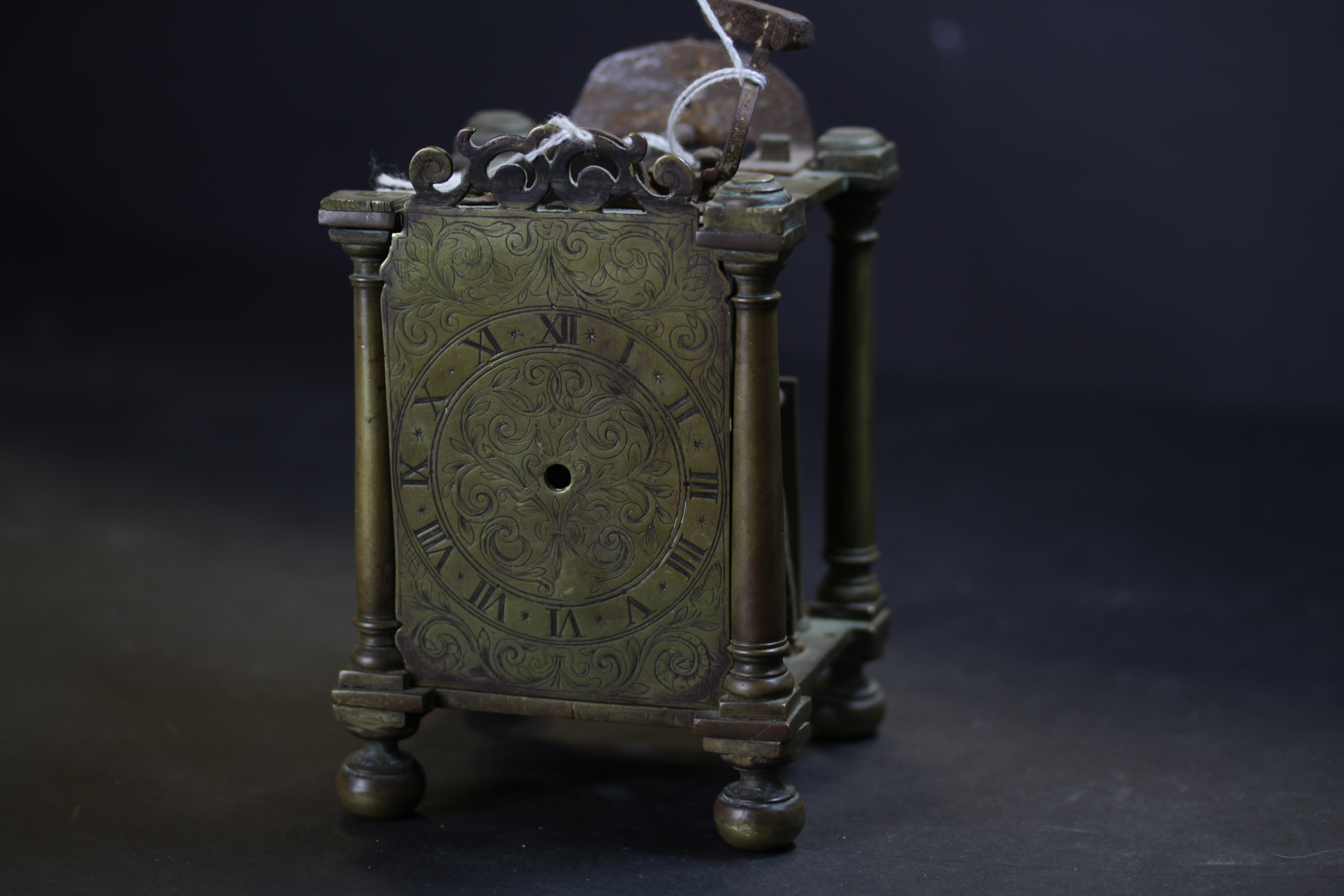 Early 18th Century brass Lantern Clock mechanism, retaining face but lacking hand, bell and sides,