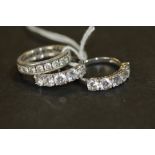 925 and CZ eternity ring and two five stone rings 10g gross