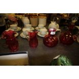 Cranberry glass decanter & 3 jugs