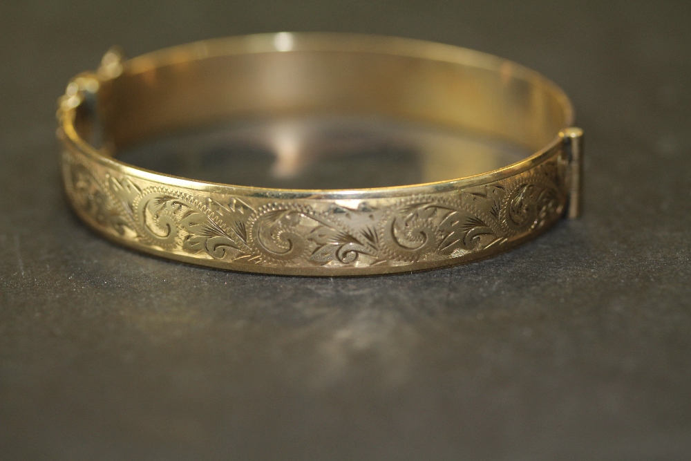 Henry Griffiths half engraved 9ct rolled gold bangle