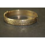 Henry Griffiths half engraved 9ct rolled gold bangle