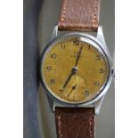 1950's Gents Omega stainless steel cased wristwatch, champagne dial with Arabic numerals and
