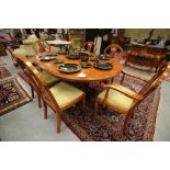 Figured veneer dining table and six chairs by Barr