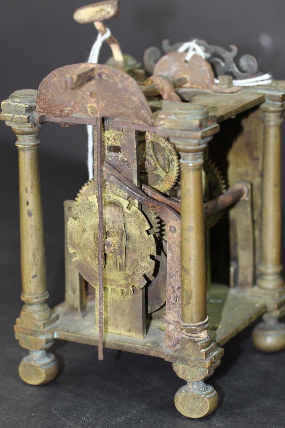 Early 18th Century brass Lantern Clock mechanism, retaining face but lacking hand, bell and sides, - Image 5 of 9