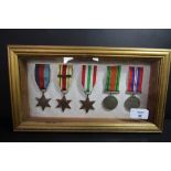 Framed campaign stars, clasps & medals - R Spatchett