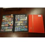 2 stamp albums containing various world stamps