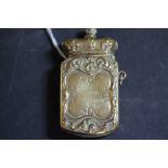 Victorian embossed brass vesta case with cassock lid (dented)