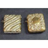 Two Victorian embossed brass vesta cases