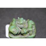 Green stone carved tiger Netsuke