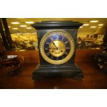 French slate mantel clock with gilt dial and striking movement