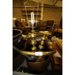 Copper coal scuttle and a brass lamp
