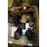 Box of binoculars, cameras, phones etc