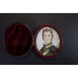 Miniature portrait, young Cavalry officer in blue and gold uniform, in hinged red leather case