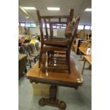 Oak extending table and four chairs