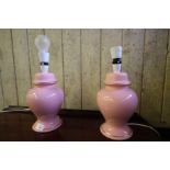 Pair of pink pottery baluster shaped electric table lamps with pink shades