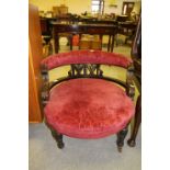 Victorian mahogany low tub shaped nursing chair with a pierced and carved back, seat upholstered