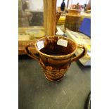 19th Century treacle glaze pottery two handled loving cup