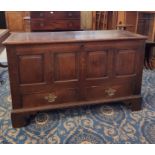 18th century panelled oak mule chest, fitted two drawers with four panel front on bracket feet