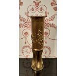 WWI Trench art vase formed from a shell, with flared rim, the body embossed with vine leaves, 34.5cm