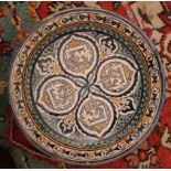 Near Eastern pottery charger of Iznik style, decorated in colours with geometric designs, 45cm