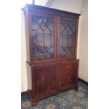 George III mahogany breakfront bookcase, dentil moulded cornice, upper part fitted two shelves